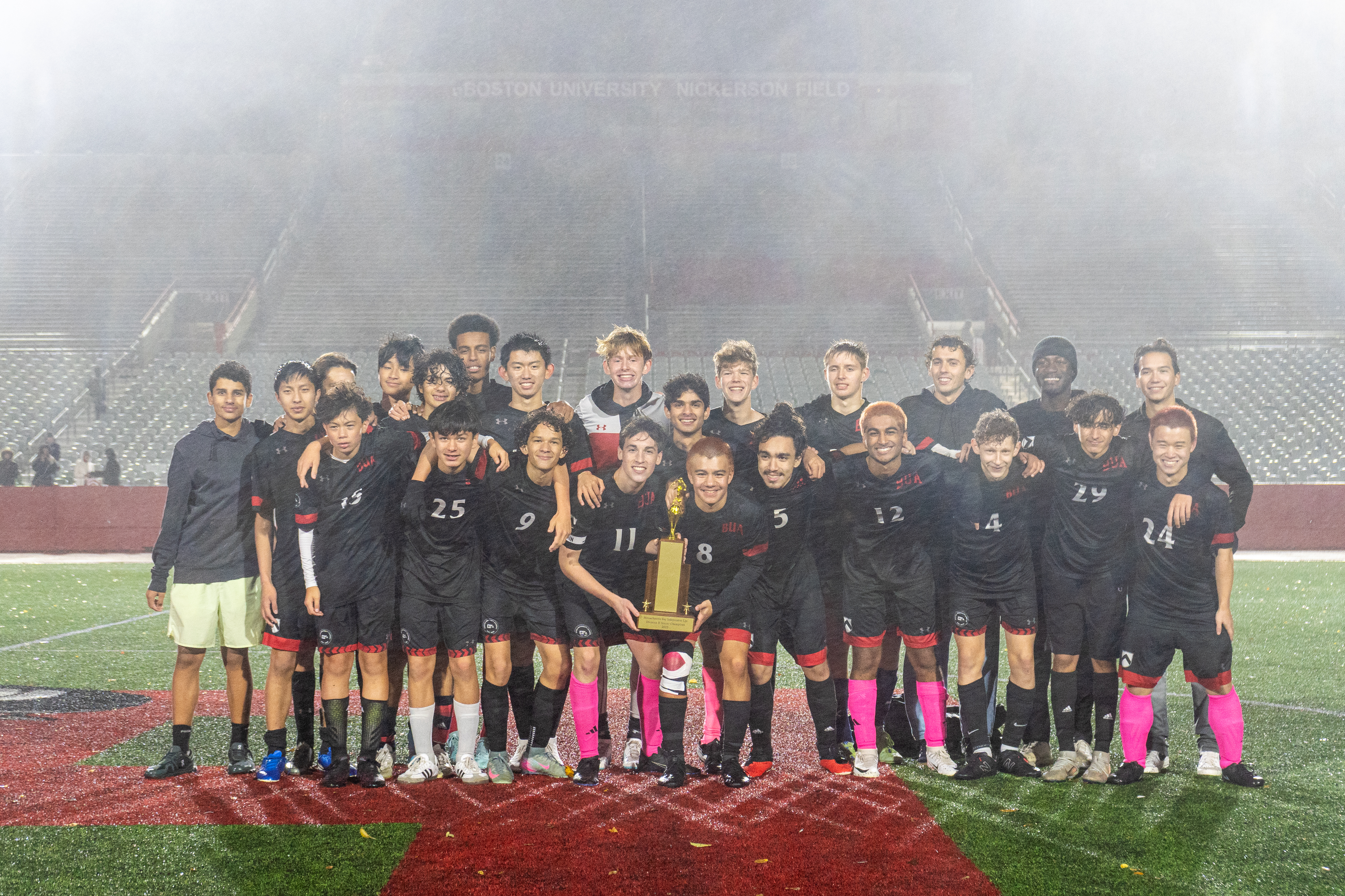Soccer team photo with trophy 